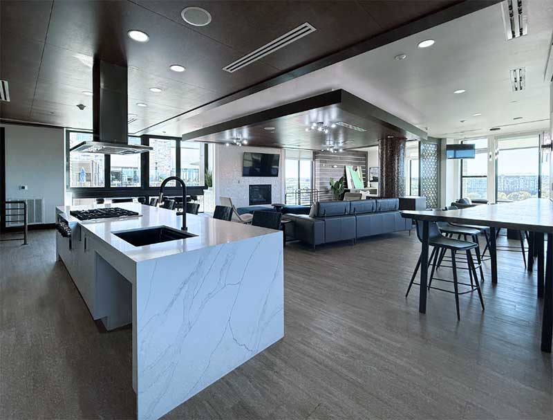 a large room with a kitchen and a couch